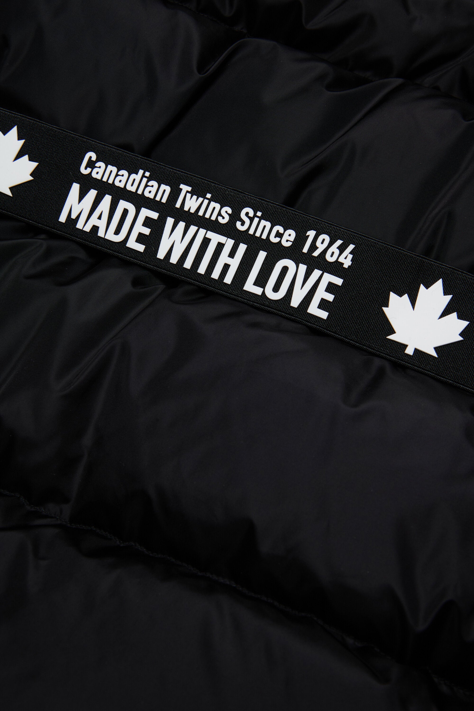 Long padded jacket with branded belt