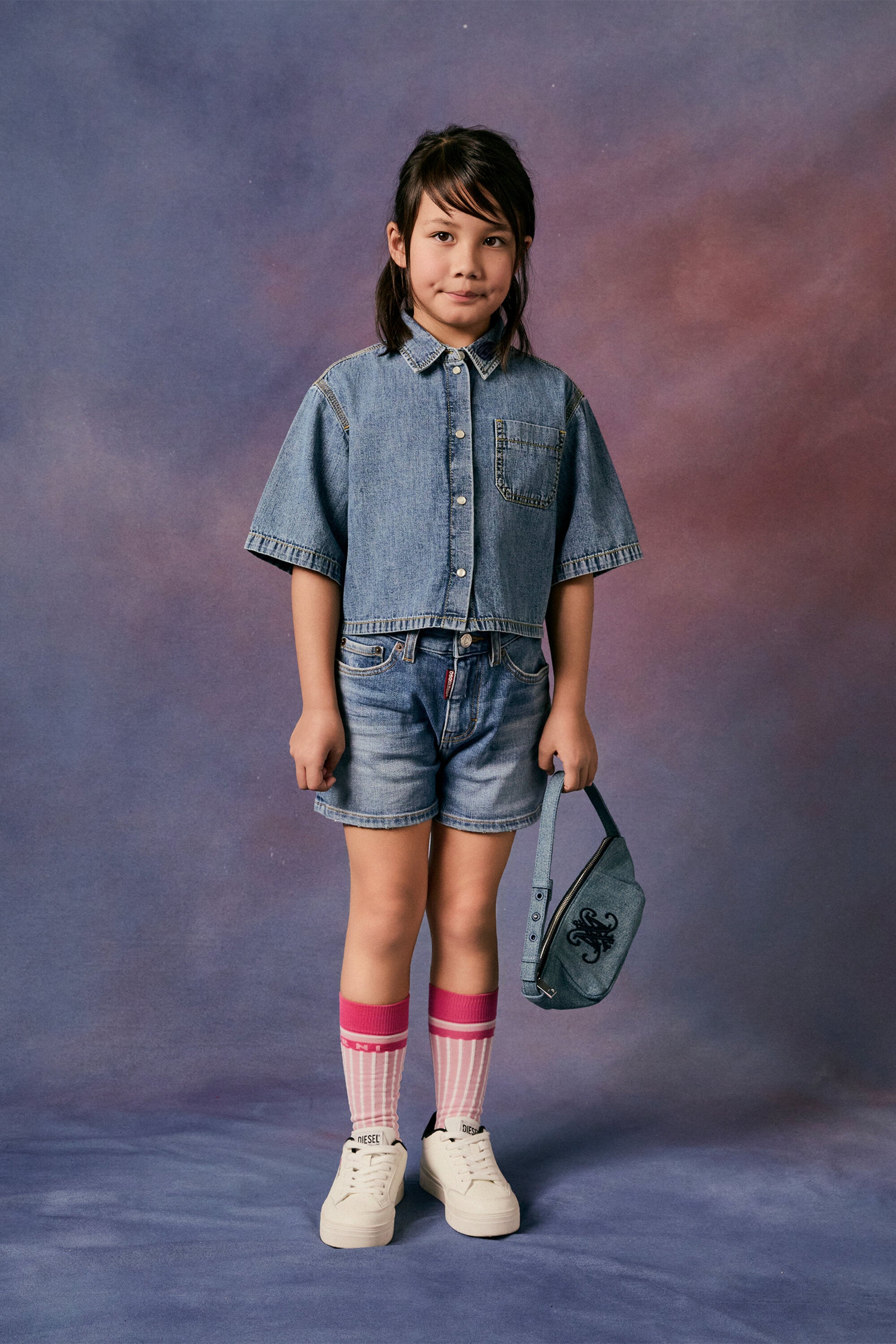 Medium blue denim shorts with abrasions