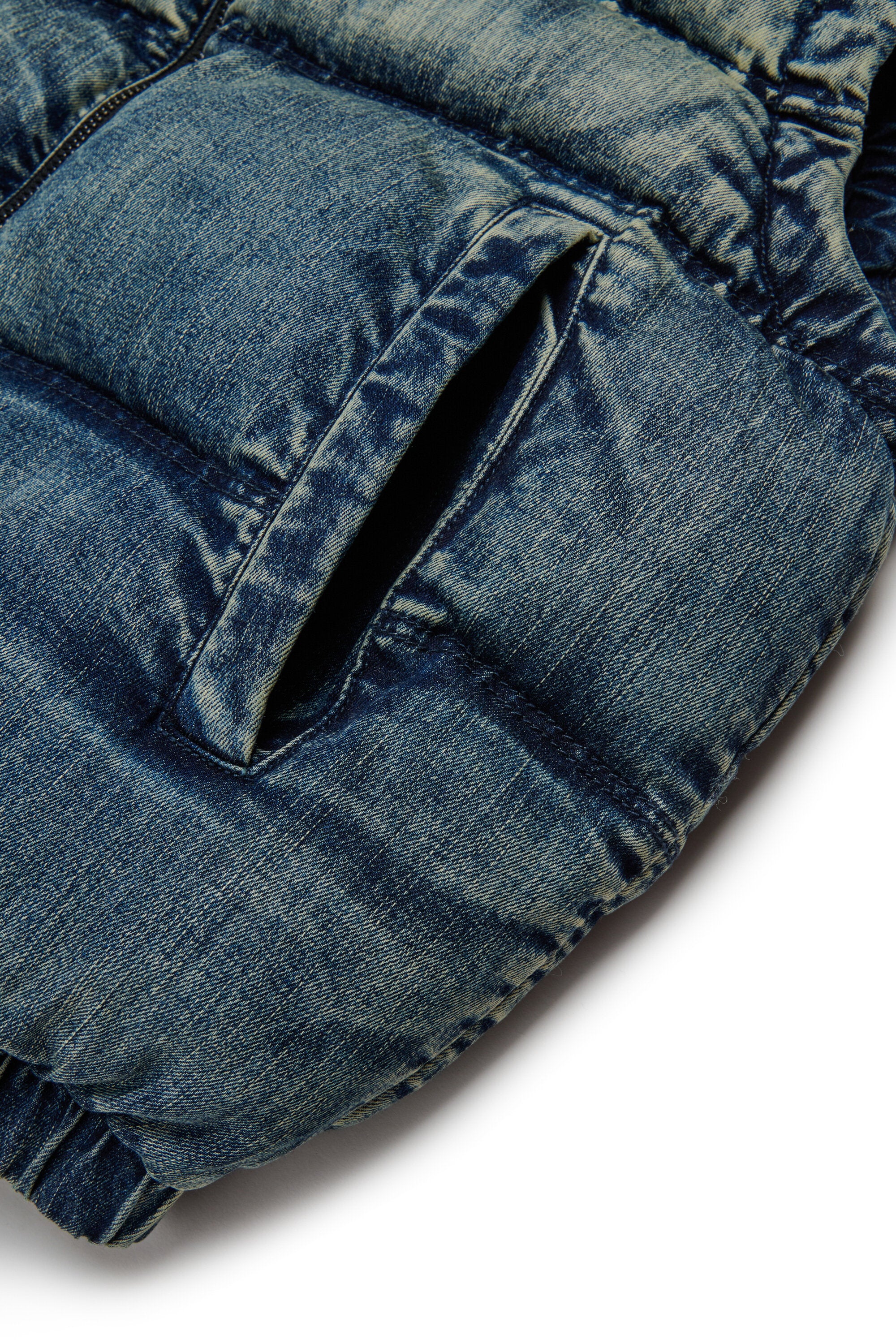 Short padded vest in dirty effect denim