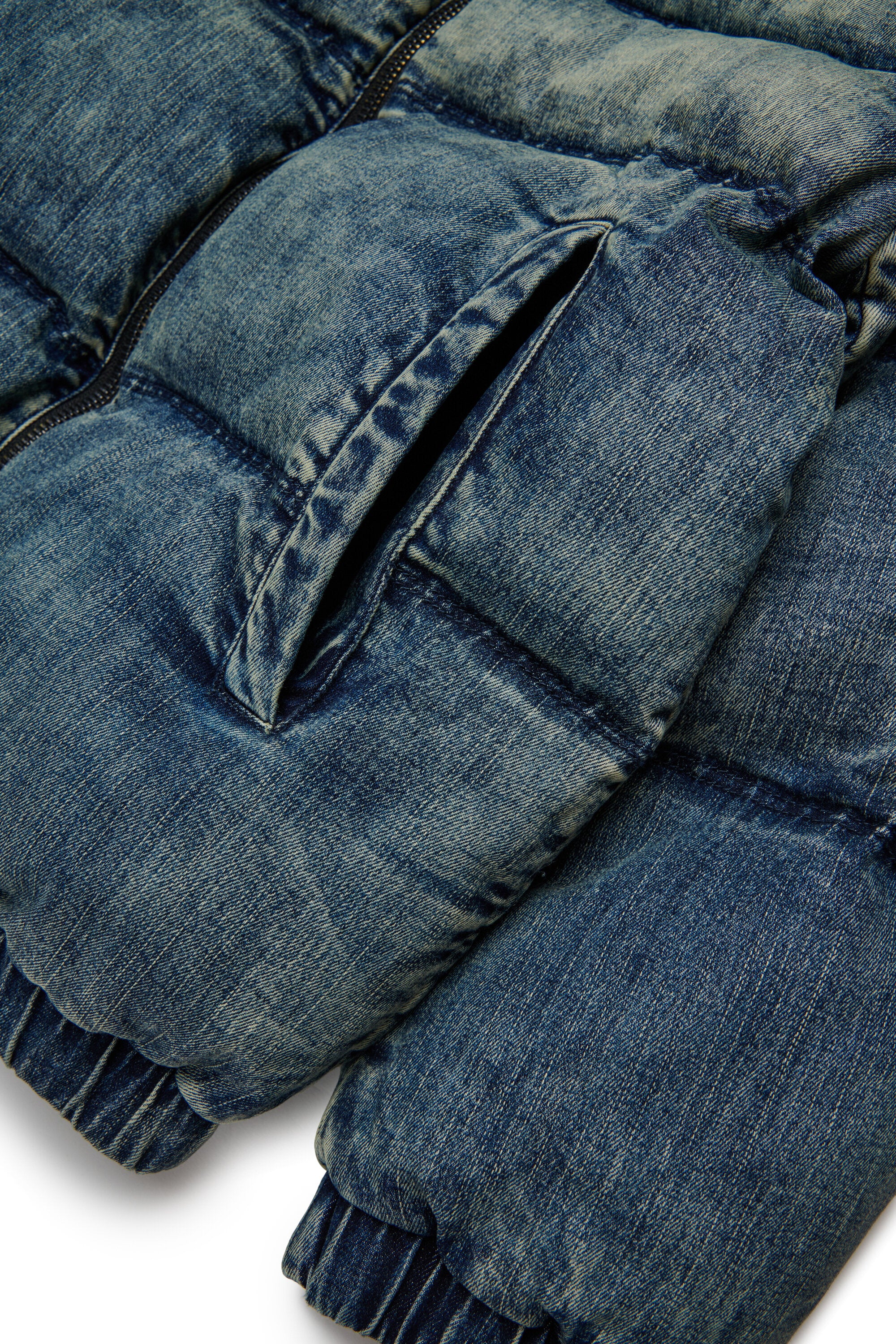 Short padded jacket in dirty effect denim