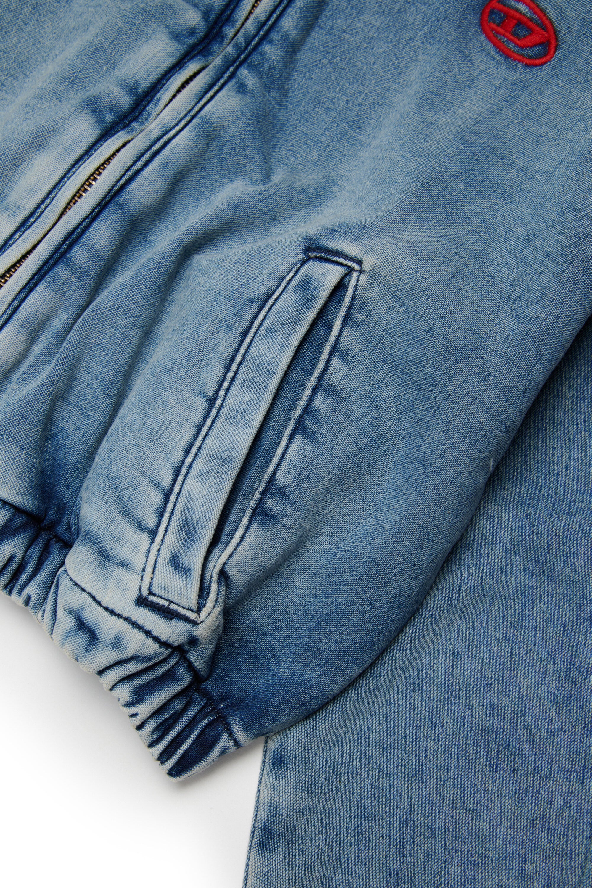 Denim jacket with embroidered logo