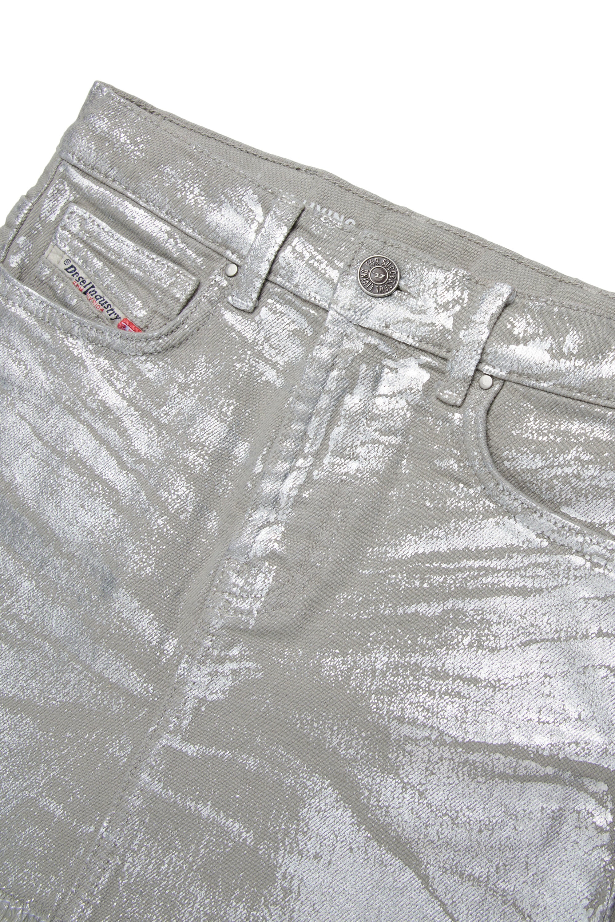Laminated mini skirt with a fringed effect