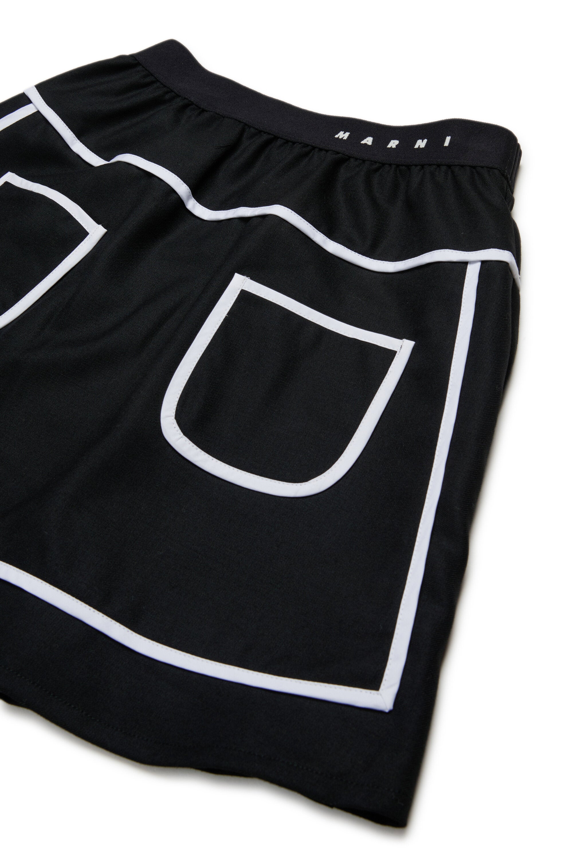 Short flannel skirt with contrasting piping