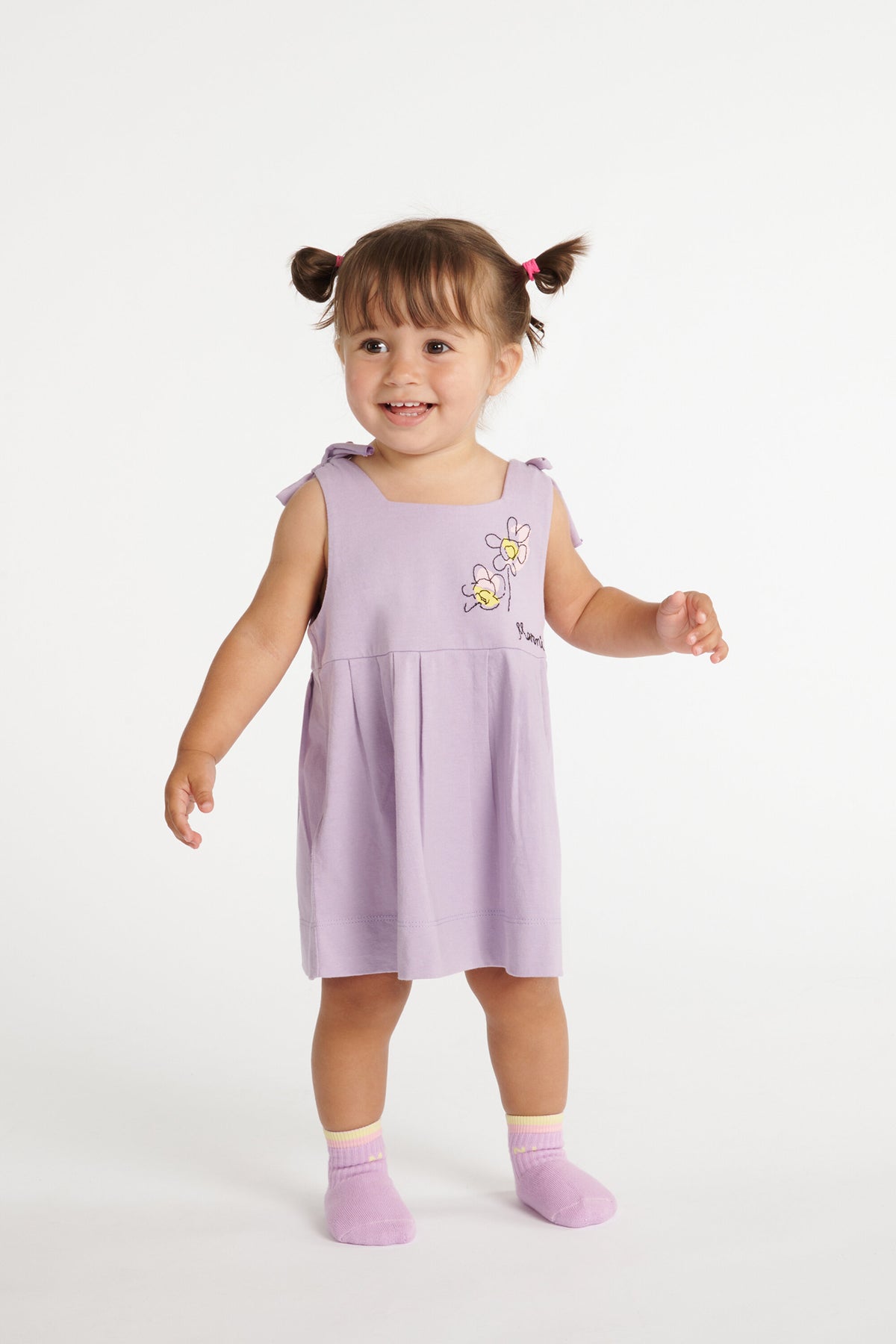 Dress with embroidered flowers and bows