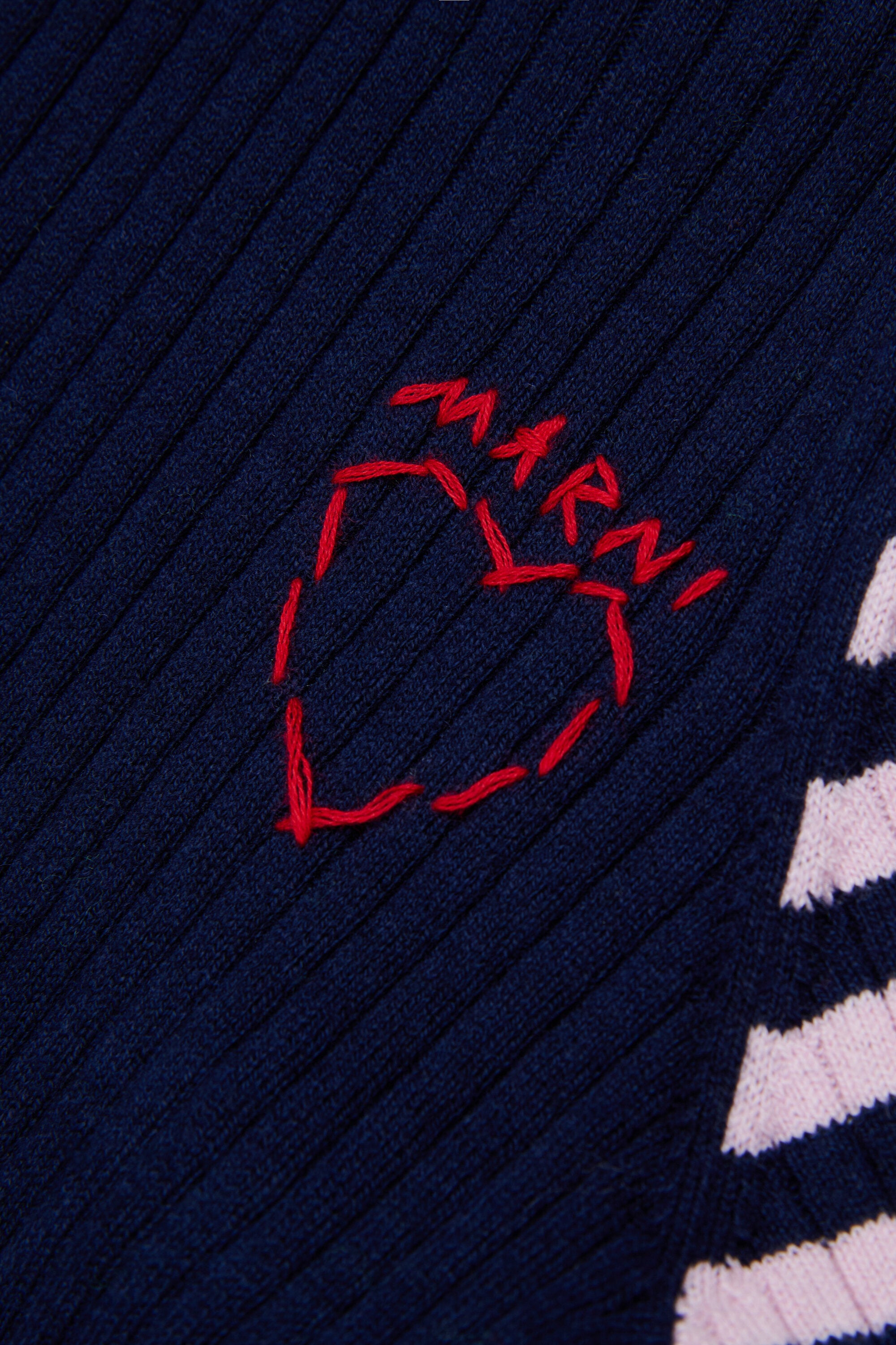 Ribbed turtleneck with heart pattern