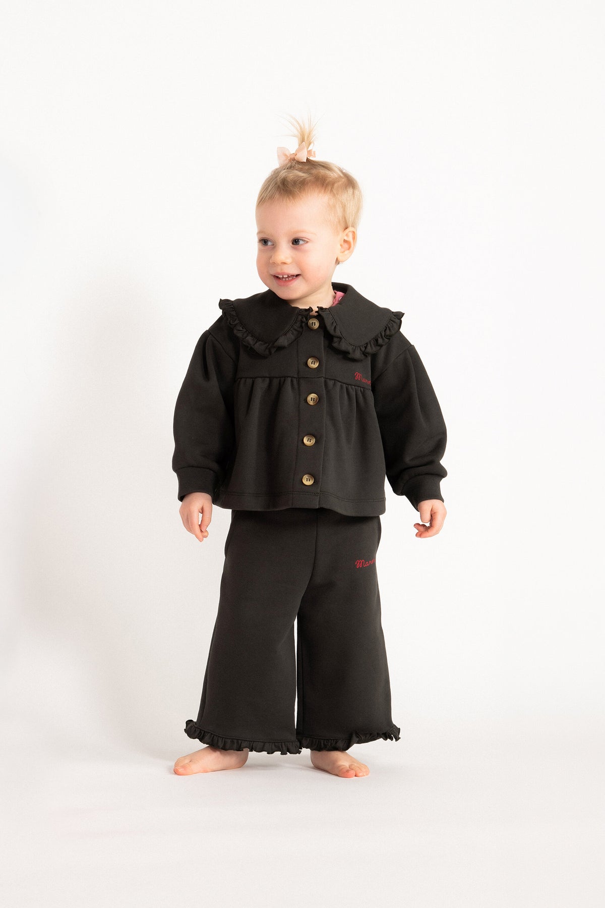 Jacket with logo and ruffles