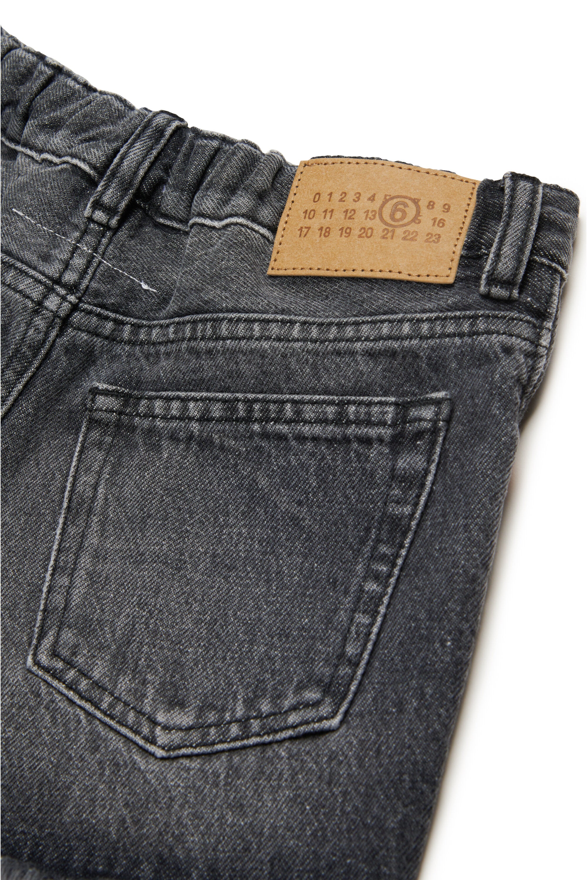 Black denim shorts with raw cut hems