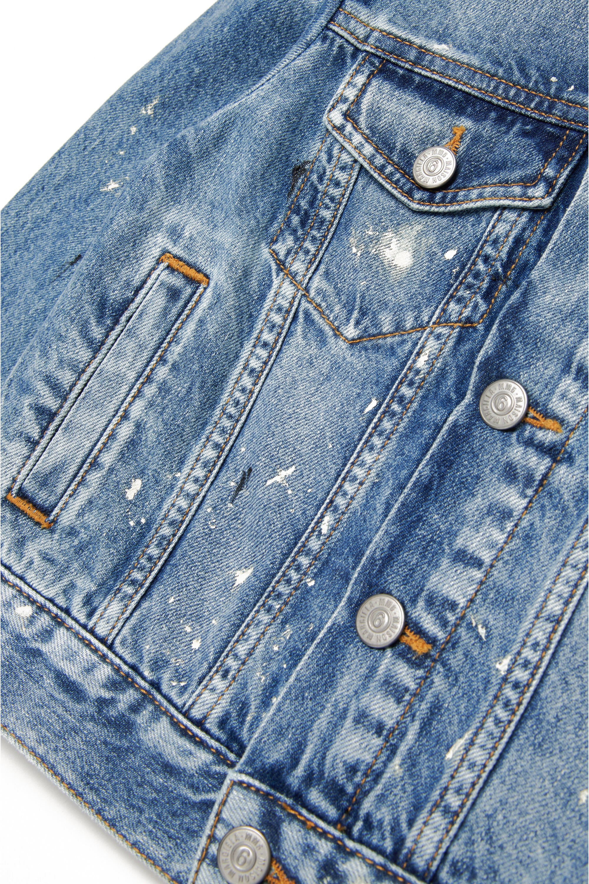 Shaded blue denim jacket with color spots