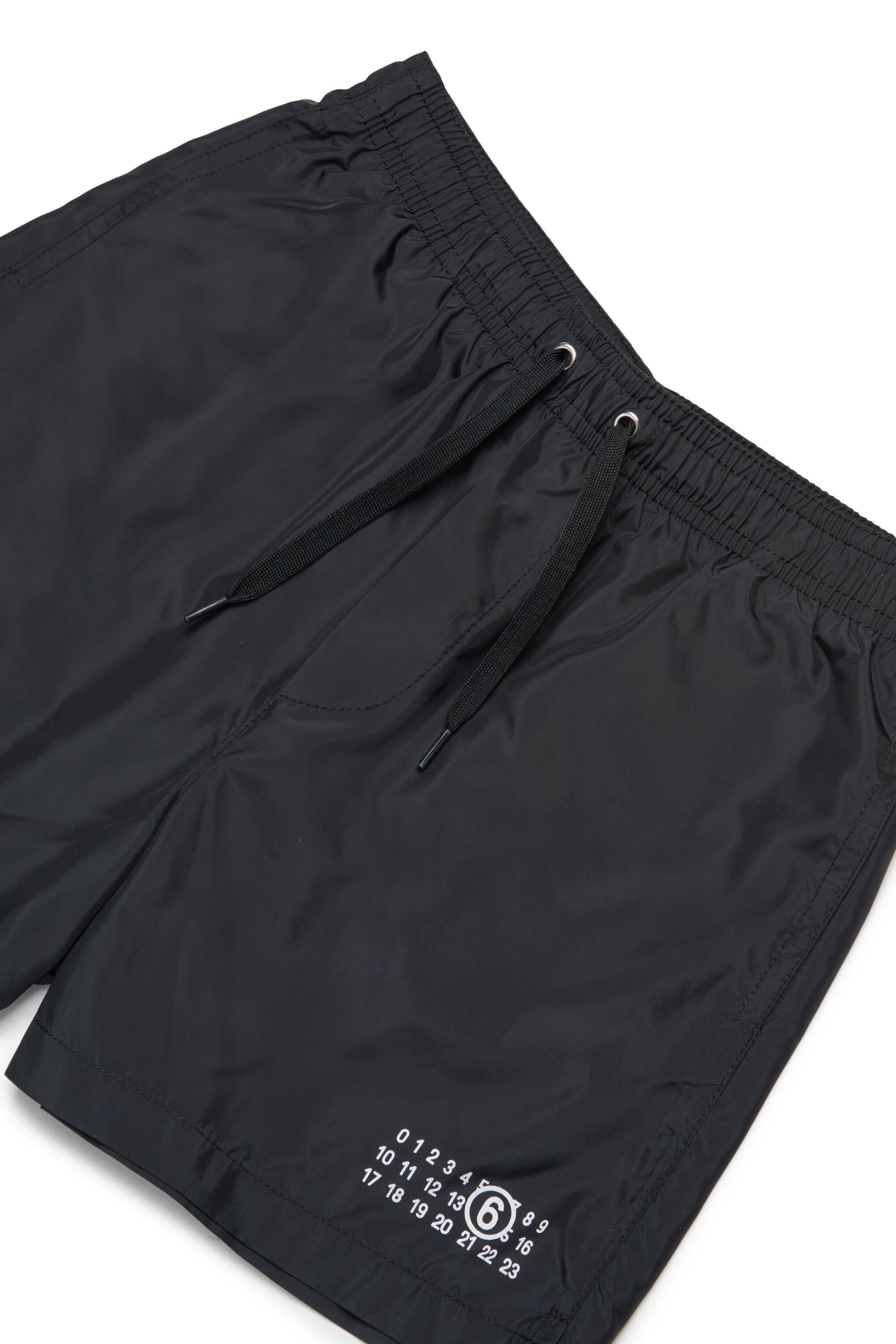 Boxer swimsuit branded with Numeric logo