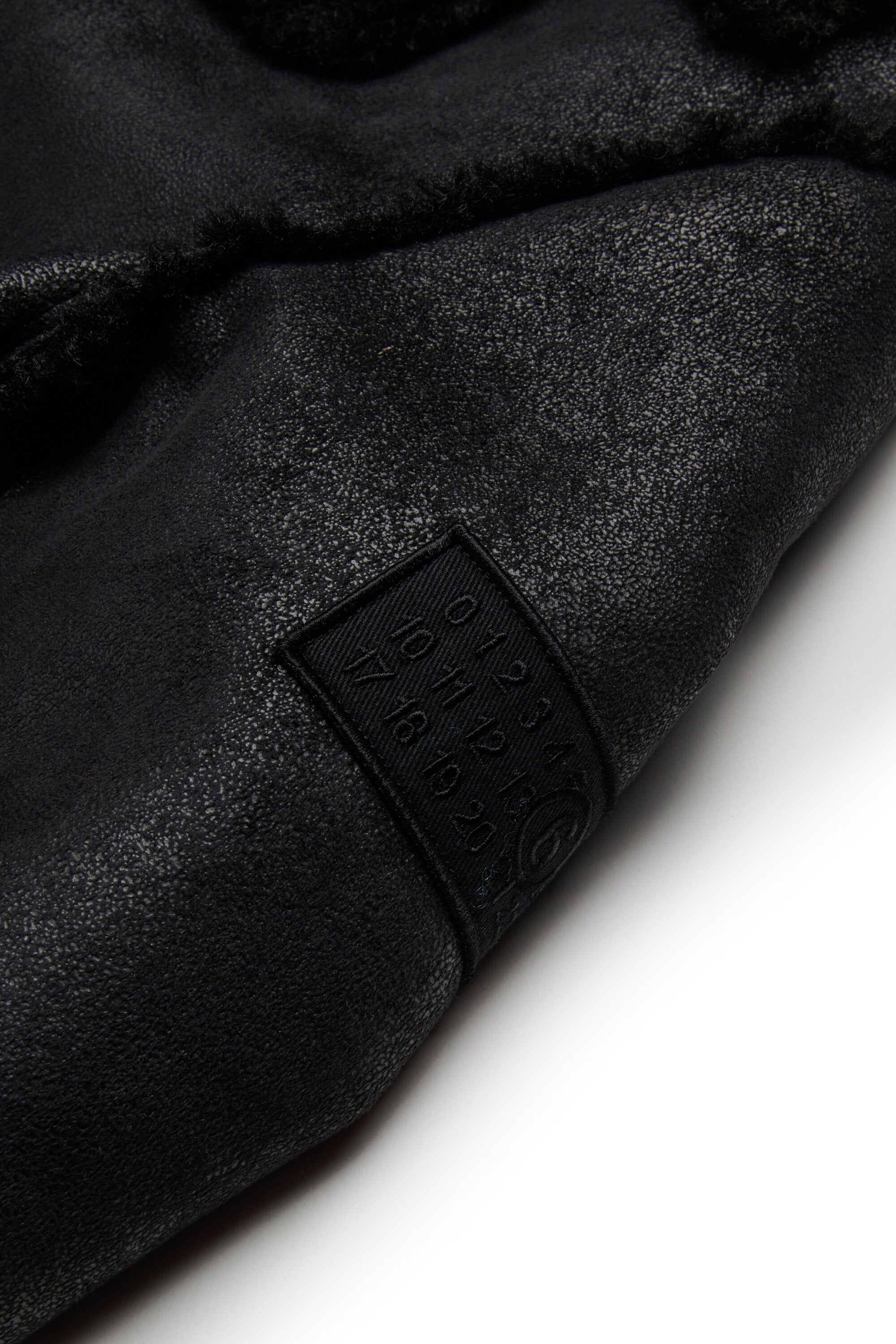 Shearling-type jacket with teddy details