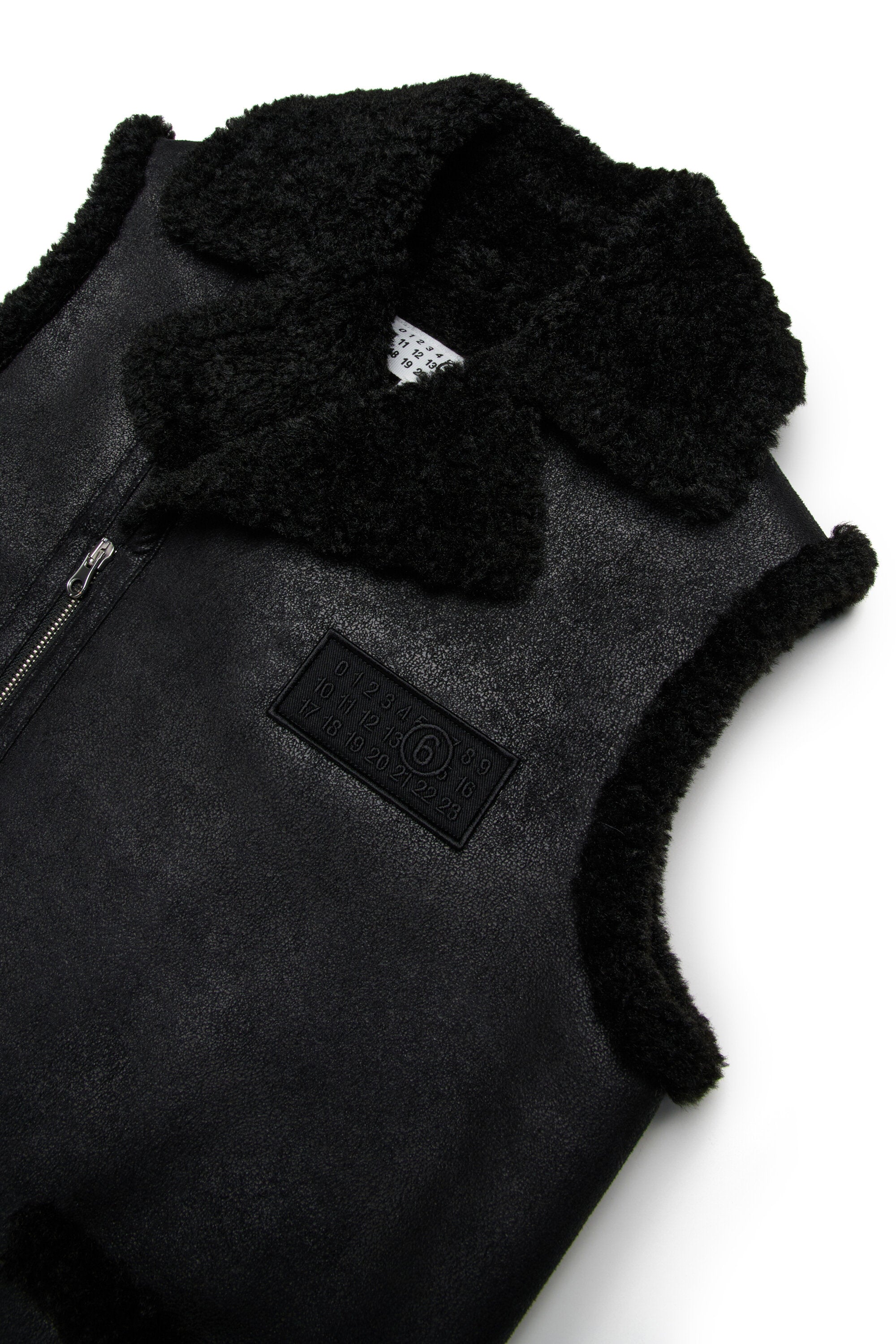 Sheepskin effect vest with teddy details