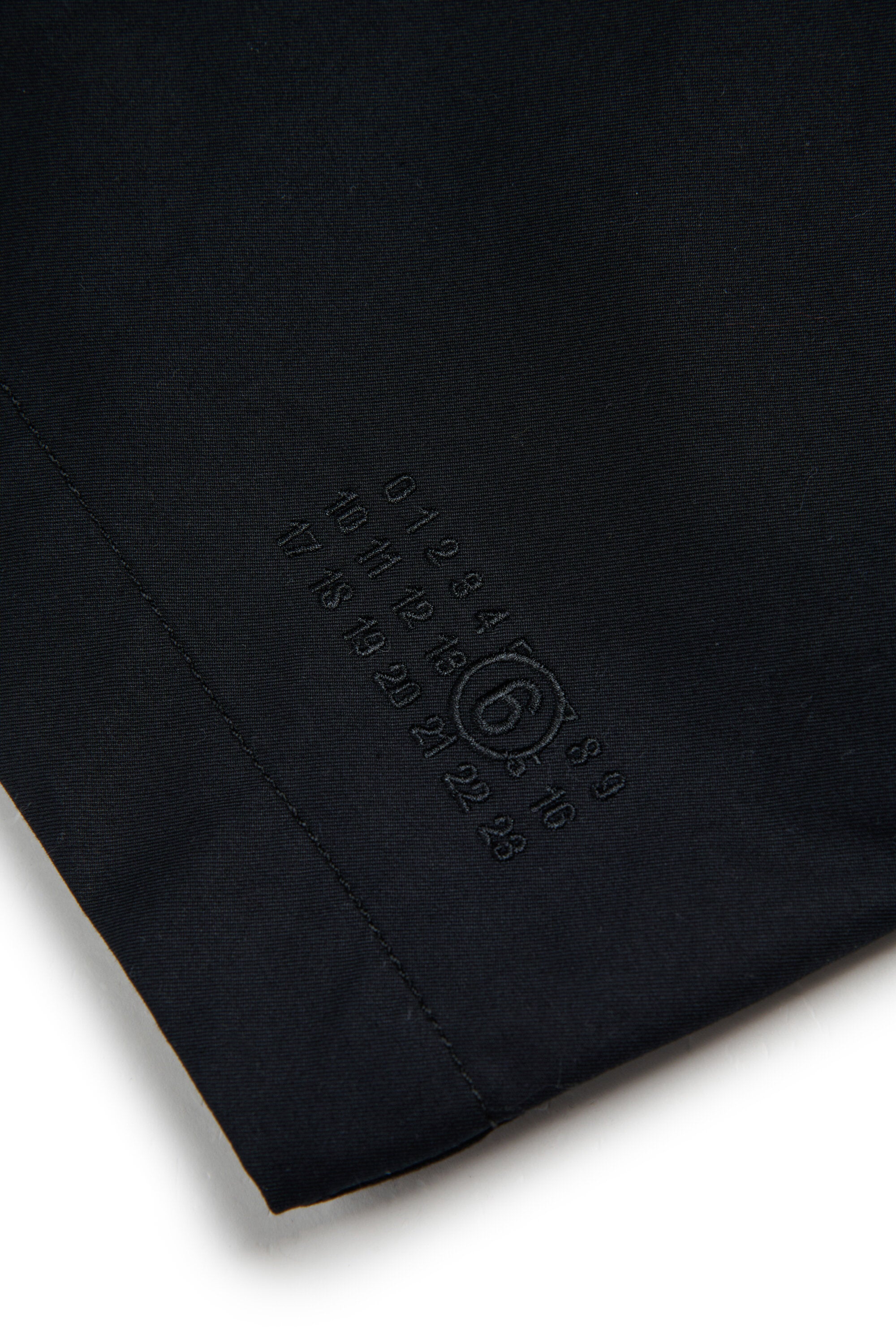 Single-breasted coat with logo