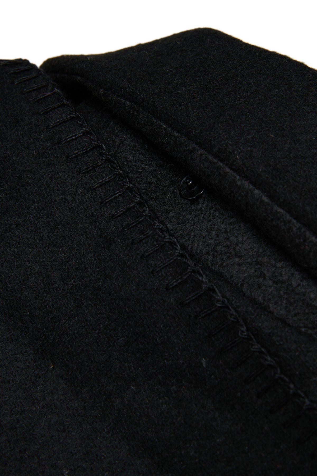 Coat with decorative cape