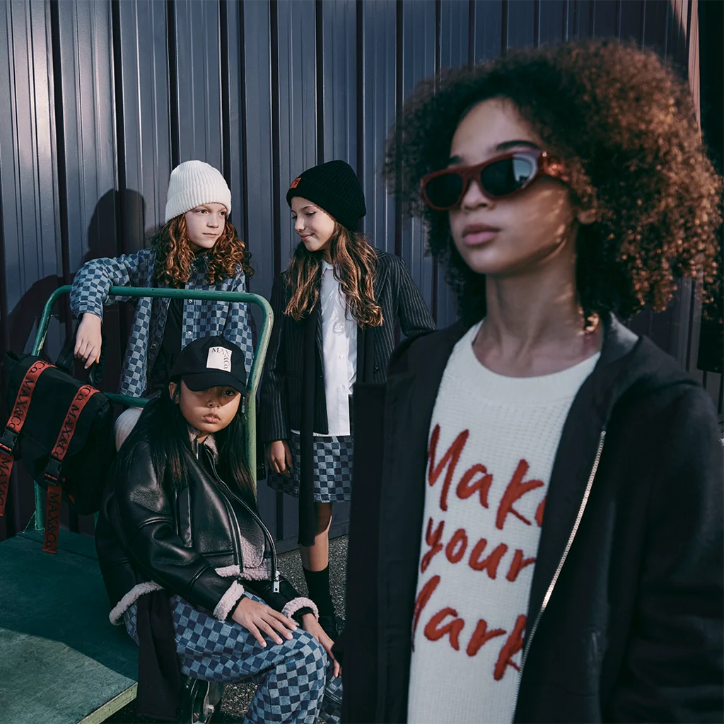 A group of child models posing with cool outfits by MAX&Co.