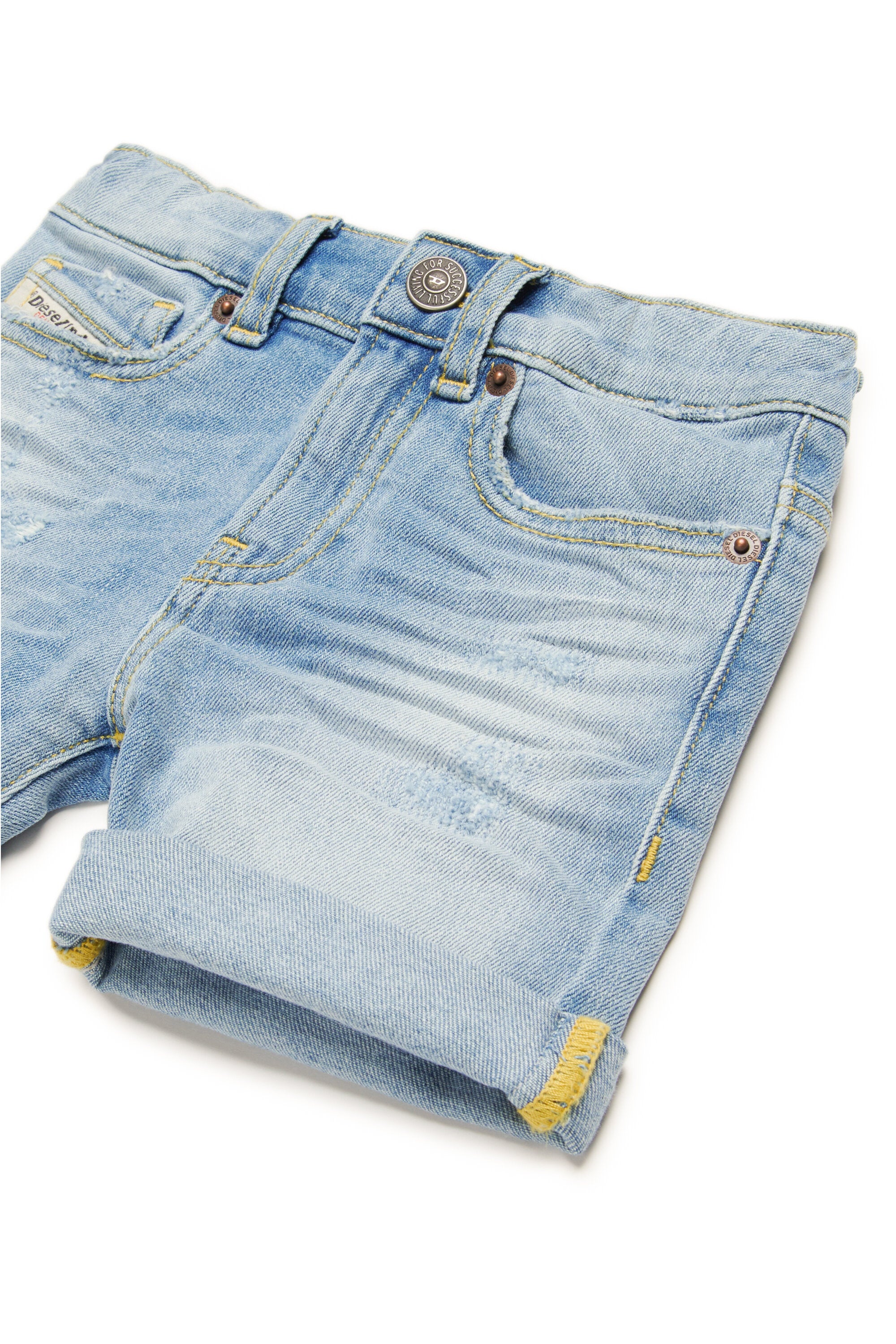 Light-coloured jeans shorts with abrasions