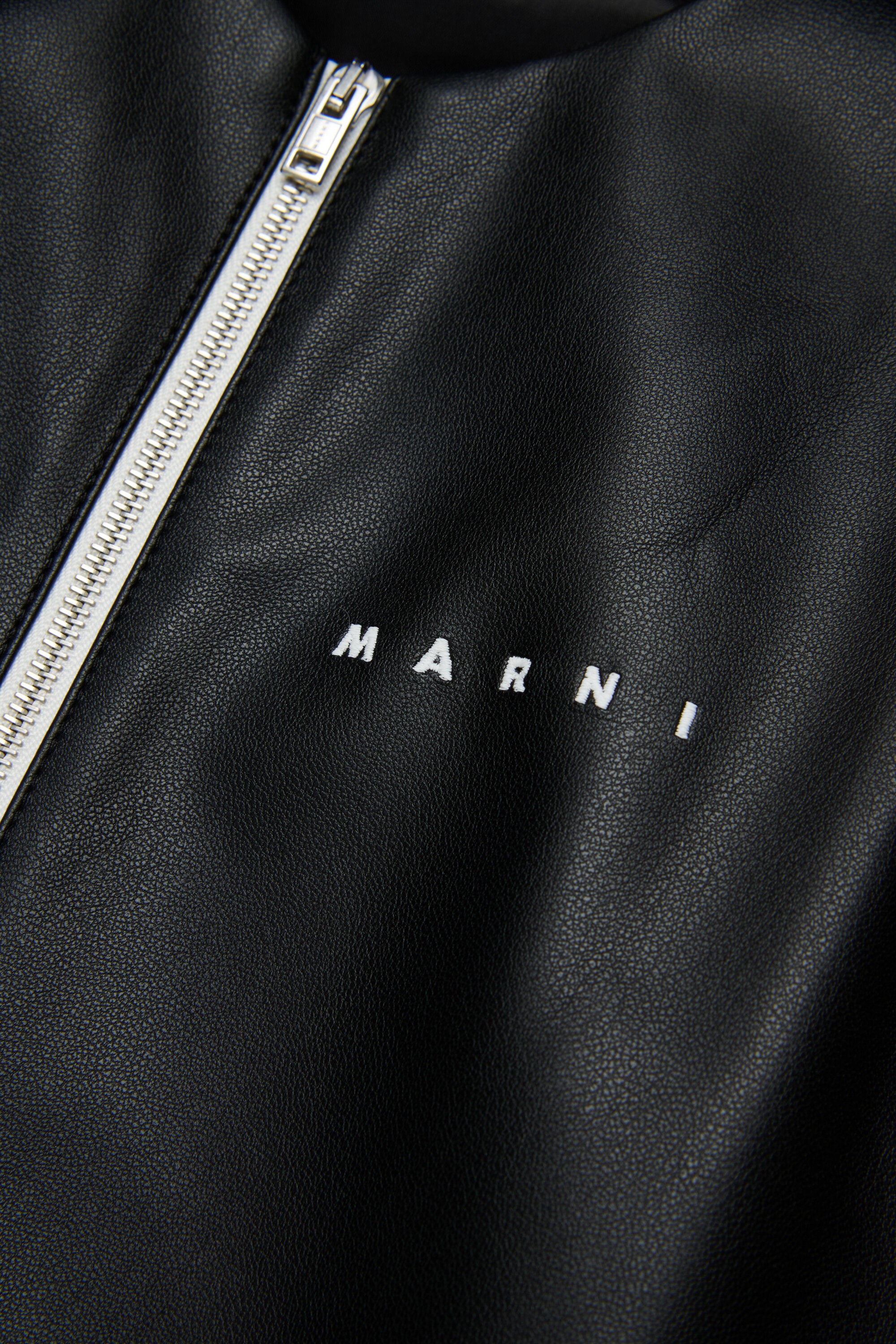 Short flared dress in Coated fabric