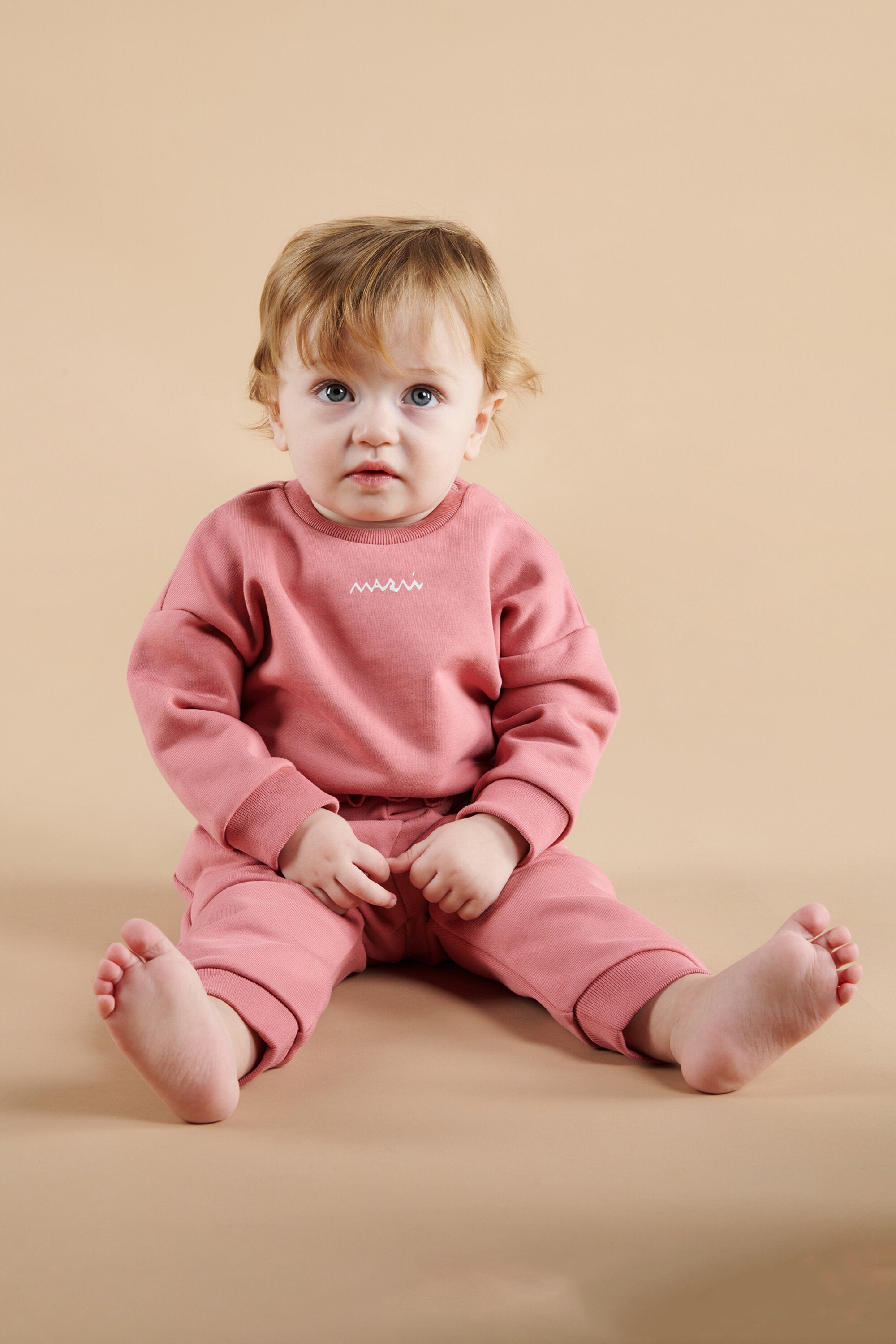 Crew-neck sweatshirt with flounces on the bottom