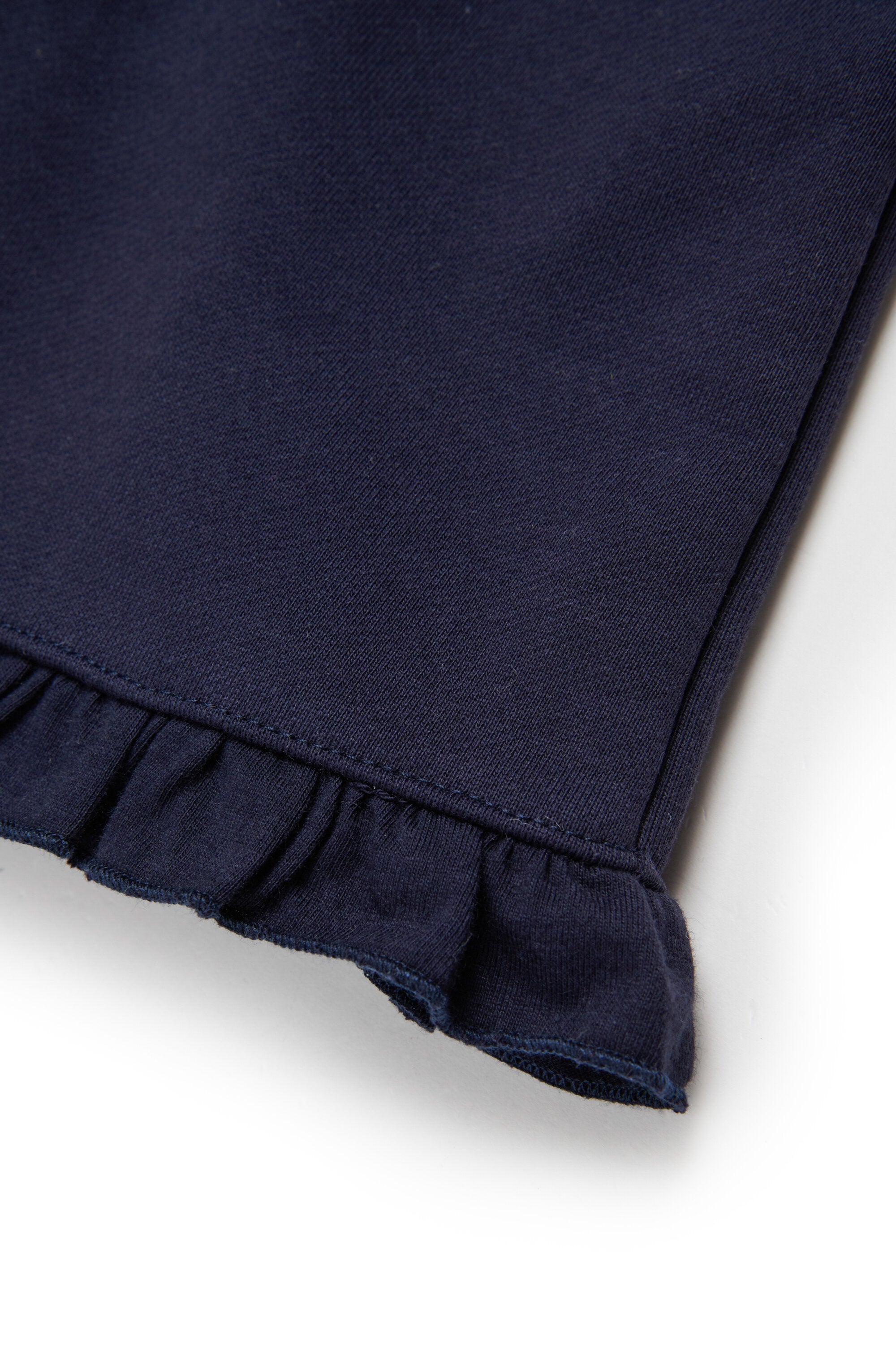 Fleece dungarees with ruffles on the bottom