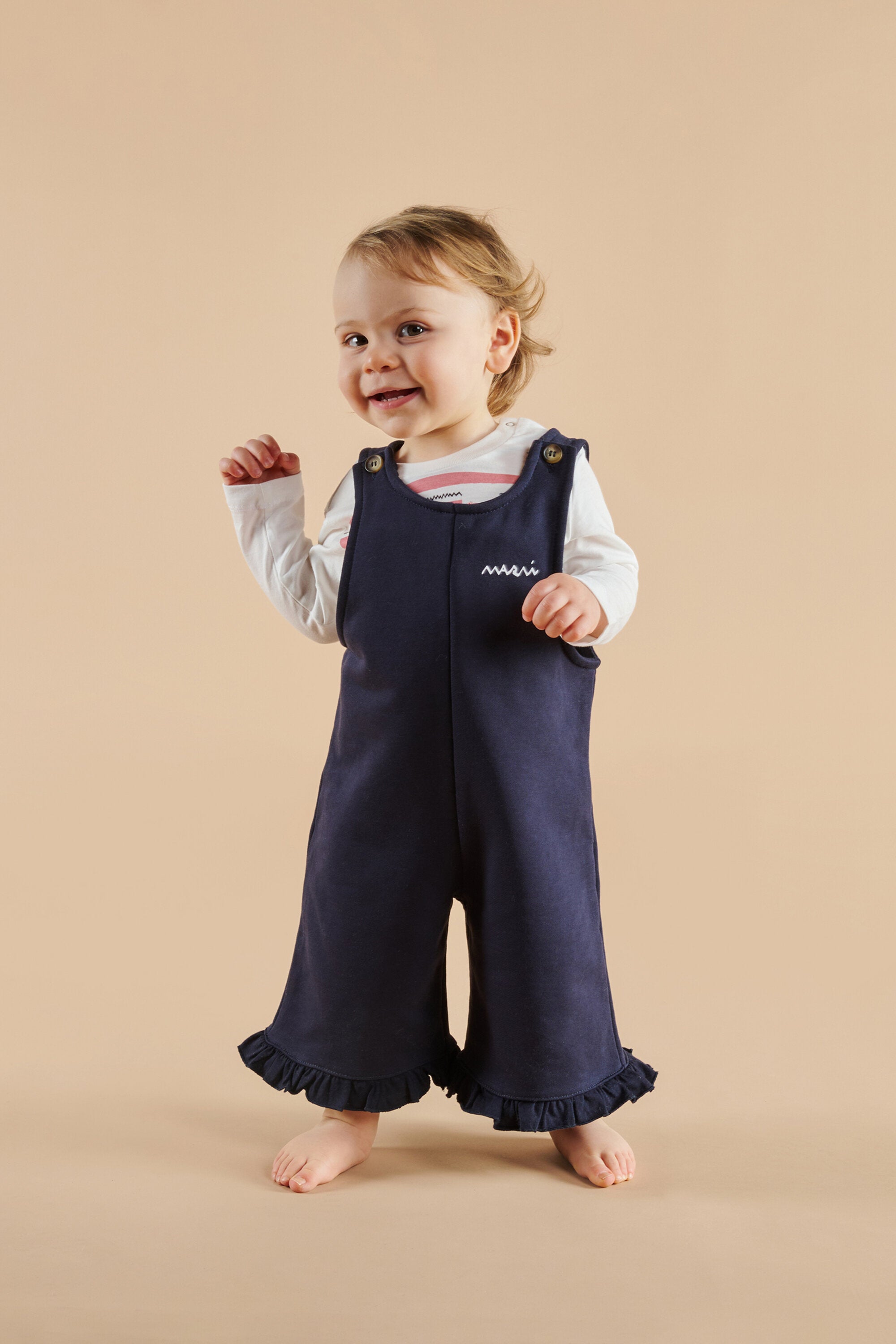 Fleece dungarees with ruffles on the bottom