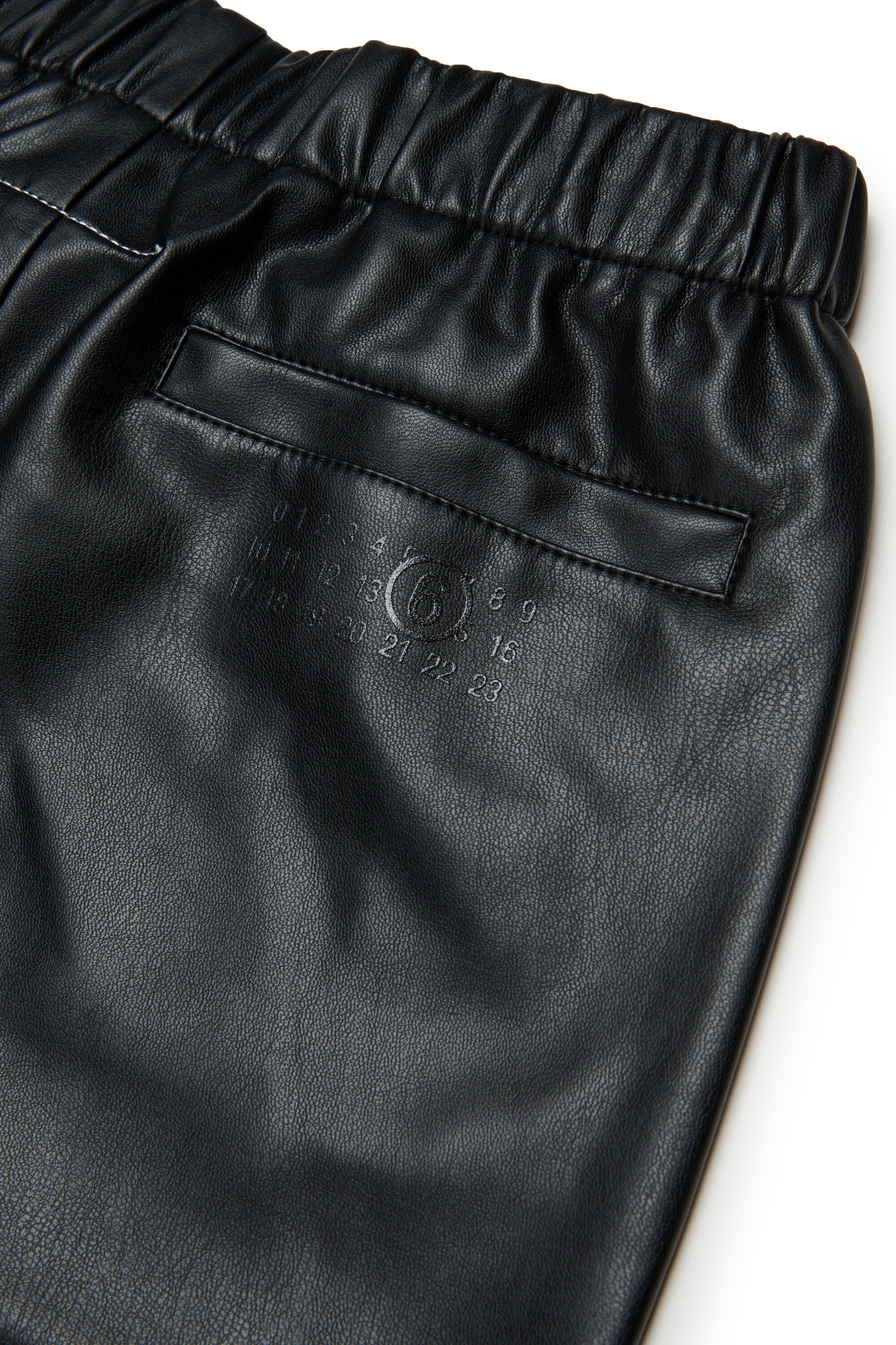 Pants made of coated fabric with zip